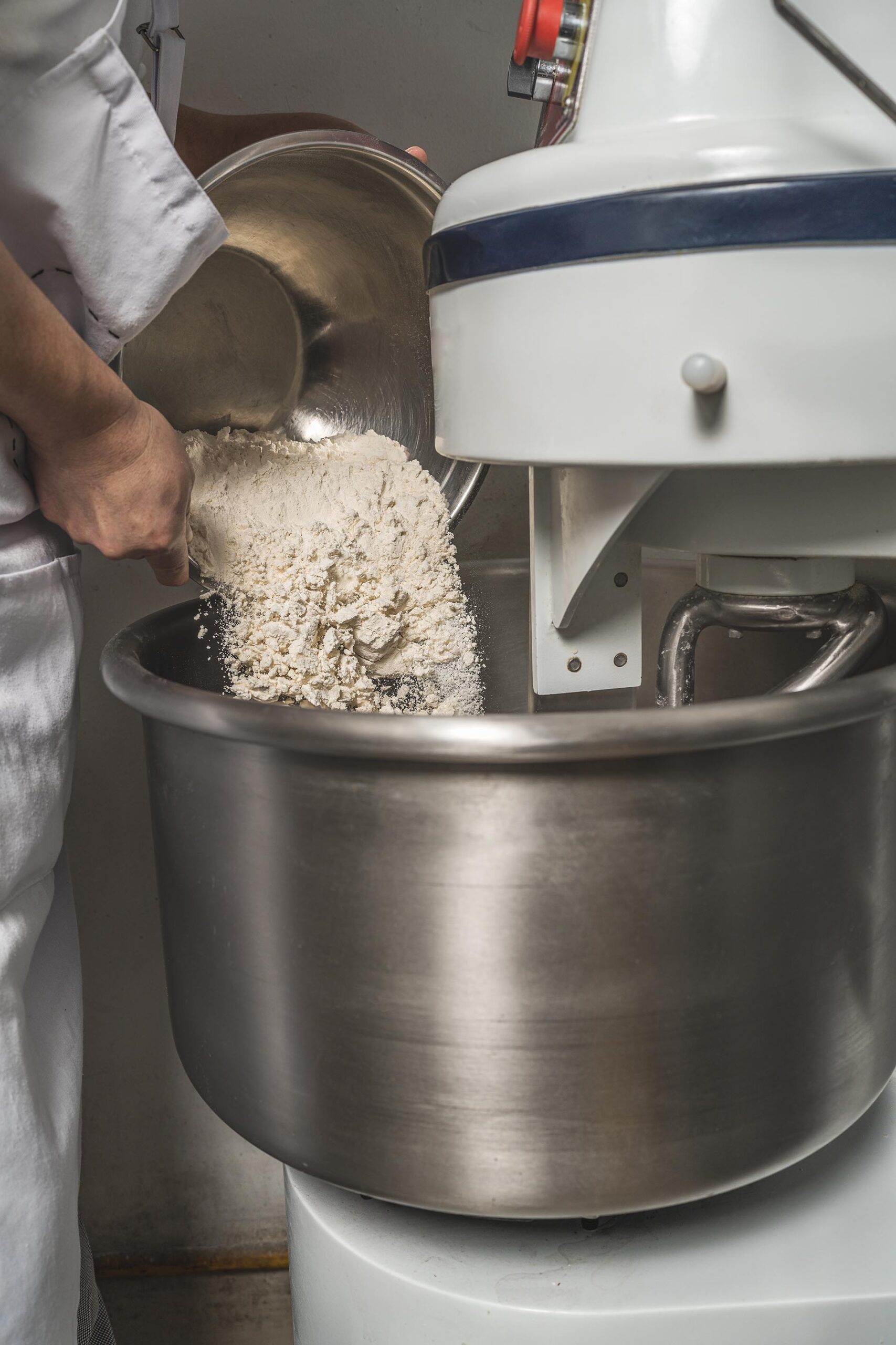 Commercial stand mixer in a professional bakery kitchen