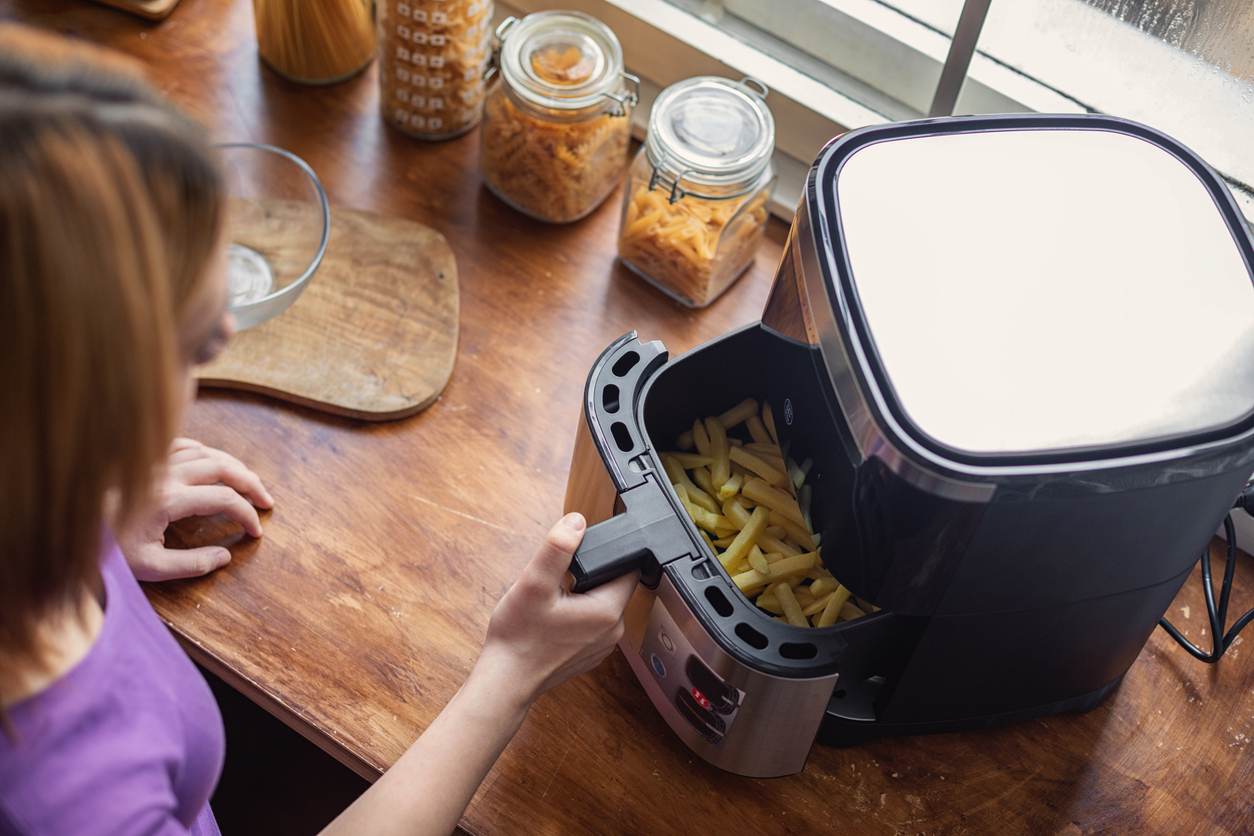Compact basket air fryer in a small kitchen