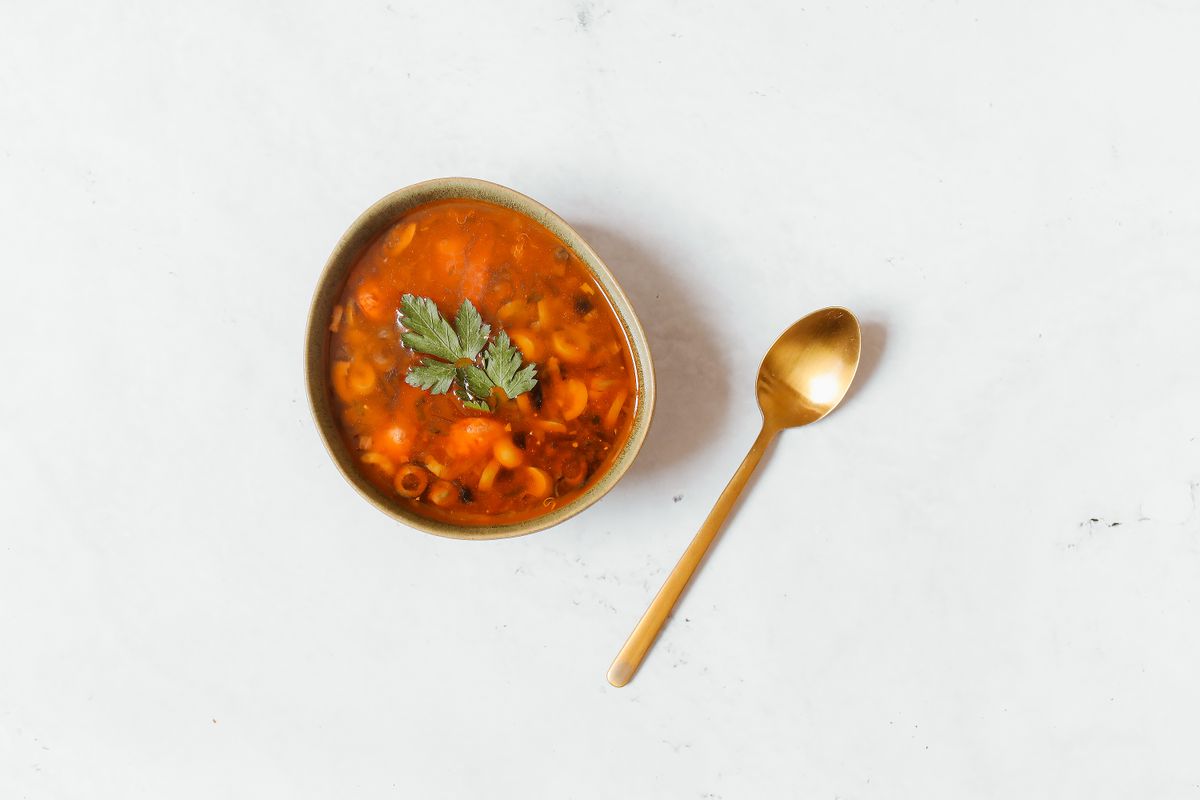 Home cook using an electric pressure cooker for weeknight meals