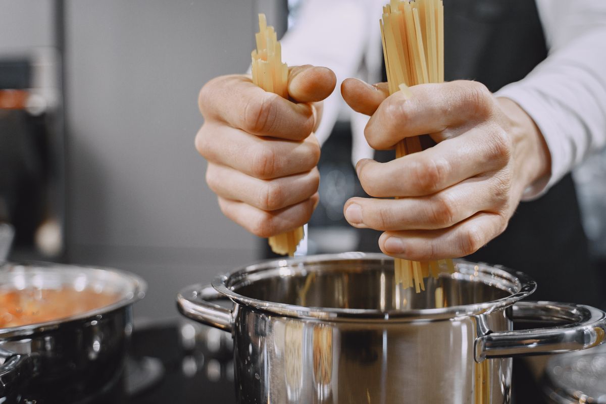 Multicooker pressure cooker preparing a family dinner in the kitchen