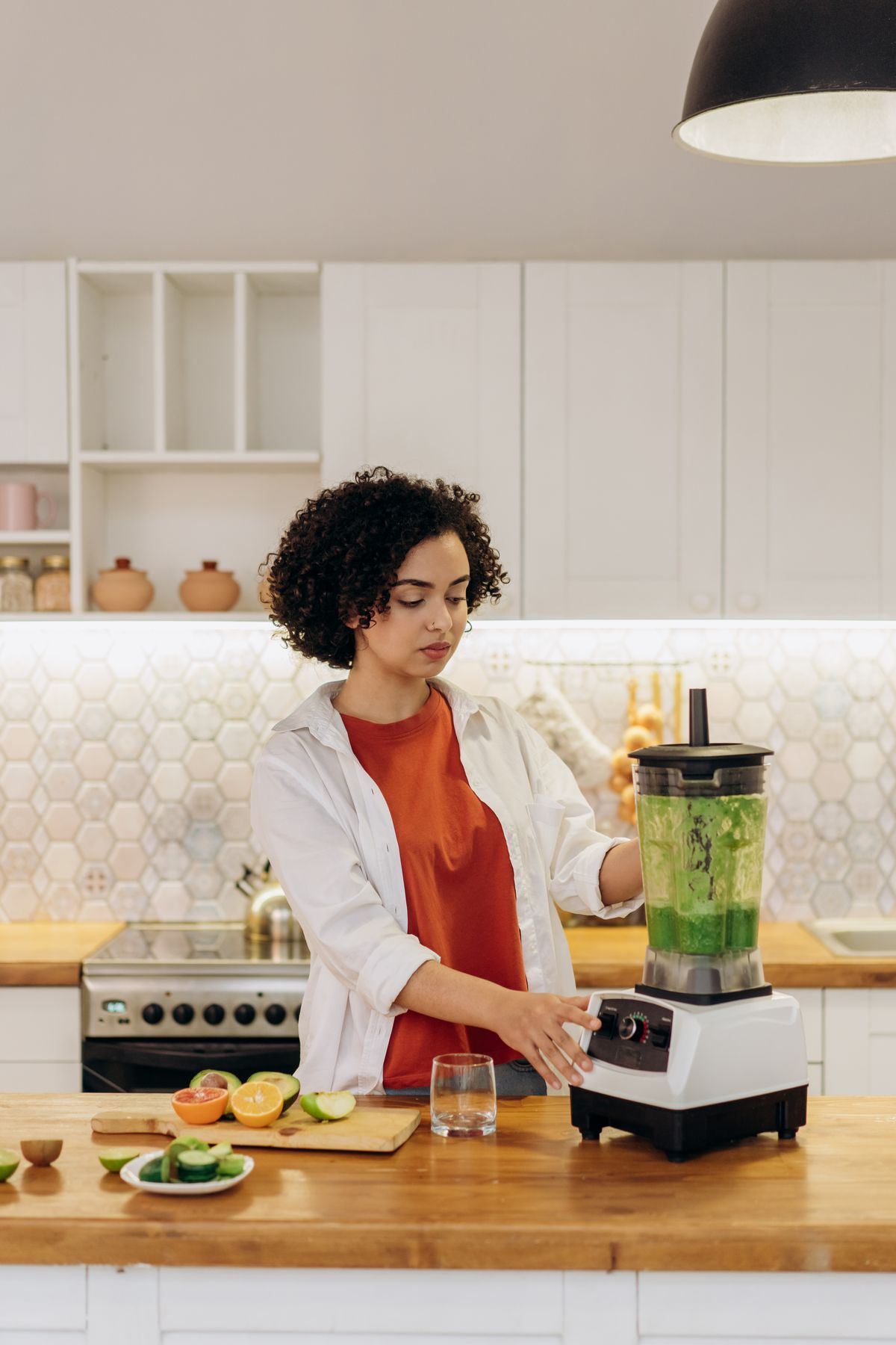 High-power blender making a fruit smoothie in a bright kitchen