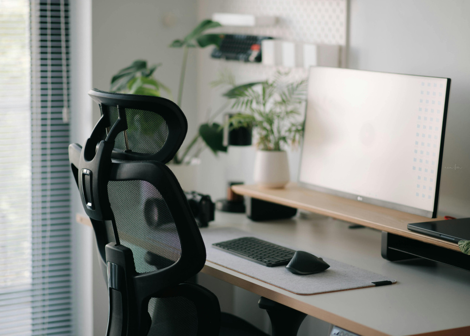 Home office desk with an ergonomic chair and computer