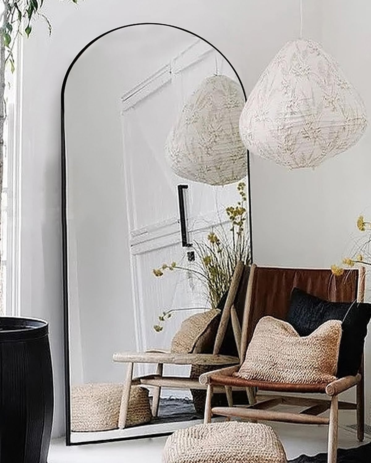 Otlsh oversized 76 by 34 inch arched floor mirror with thin black aluminum frame in a bright living room