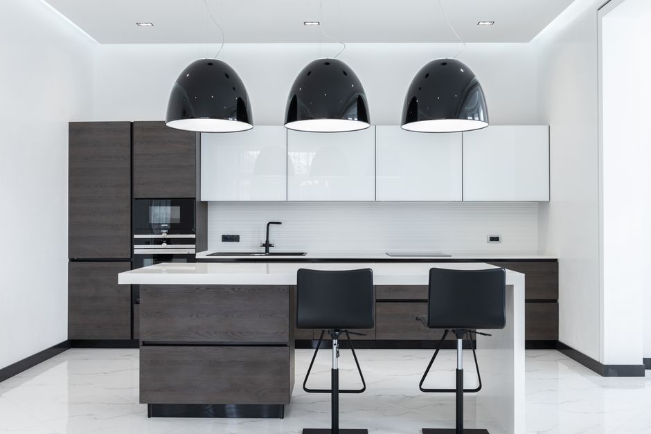 Modern pendant lighting above a kitchen island counter