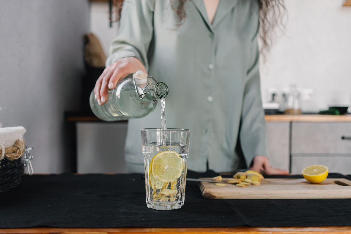 Kitchen counter with a water filter pitcher beside drinking glasses