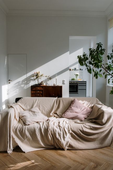 What Size TV Should I Get for My Living Room? — a cozy sofa facing the television