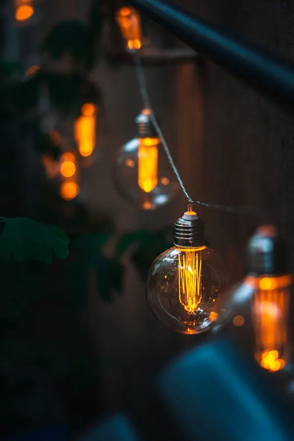 Which Outdoor Halloween Lights Should I Buy? A 2026 — warm string lights outdoors at dusk